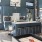 a kitchen with a bar and chairs