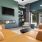 a living room with a tv and couches